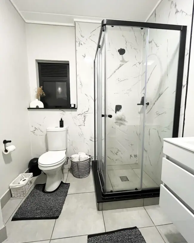 Minimalist Black and White Bathroom with Marble Walls