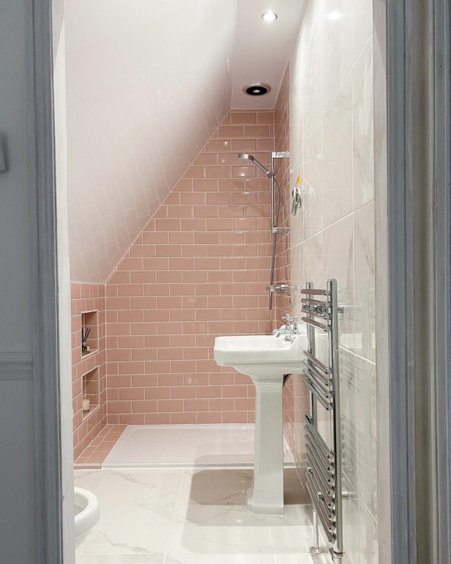 Narrow Pink-Tiled Shower Space