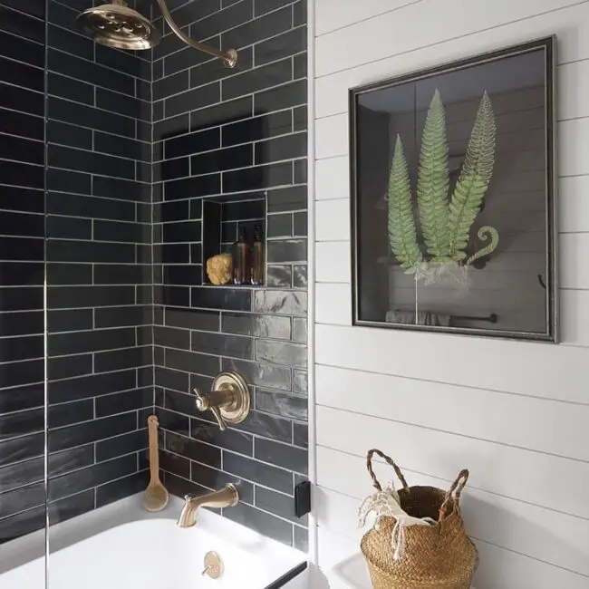 Cozy Bathroom with Shiplap Walls and Black Tiles