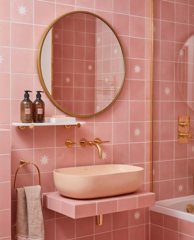 Starry-Tiled Bathroom with Gold Fixtures