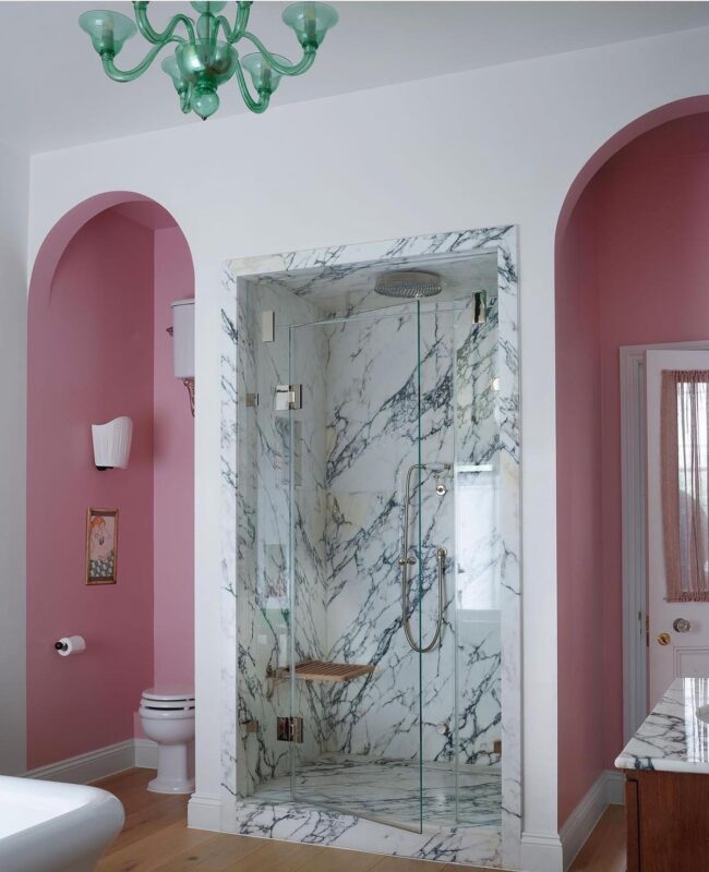 Pink Marble Shower Framed by Elegant Arches