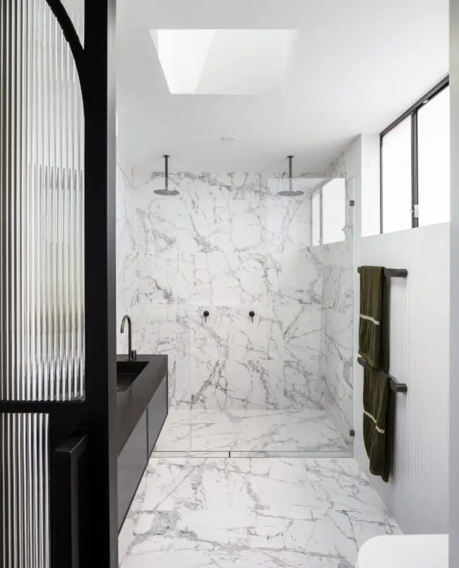 Sleek Marble Bathroom with Dual Shower Features