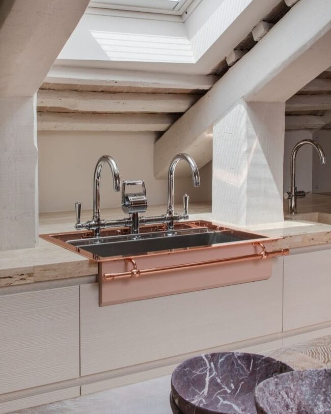 Minimalist Pink Sink Under a Skylight